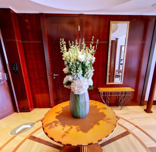 Flower arrangement on a round table in the entryway