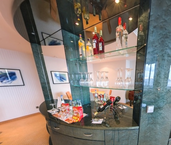 Round house bar with a drinks selection and wall art