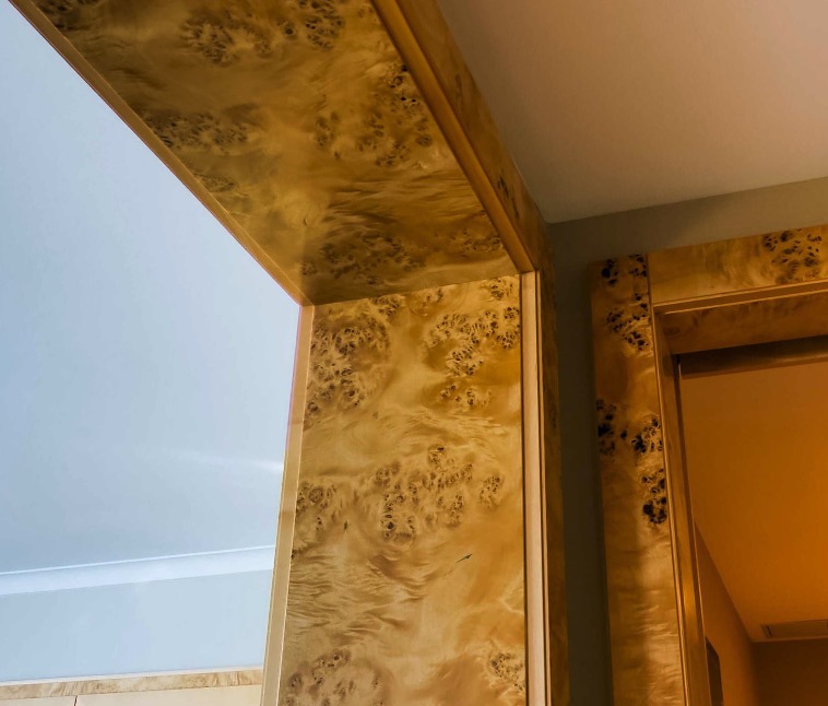 Fine burl wood panelling in the entryway