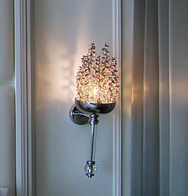 Wall-mounted sconce with a beaded crystal cluster shade